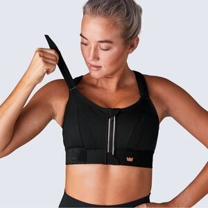 SHEFIT 2Luxe Moisture-Wicking Sports Bra in Black with Pink Logo